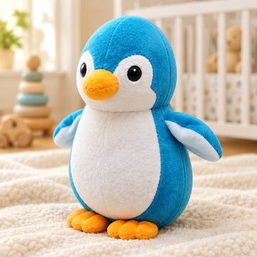 Blue-and-white penguin plush toy in a cozy nursery setting