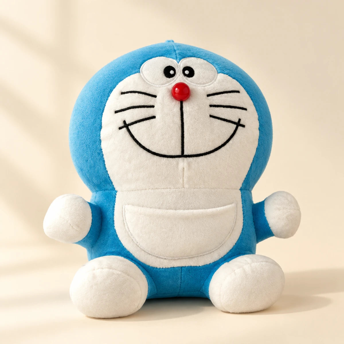 Smiling blue-and-white cat plush in a softly lit studio setting