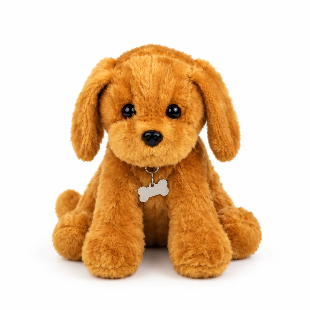 Golden retriever puppy plush toy hero shot on white background showing full front view of fluffy golden caramel sitting puppy plush with long floppy ears two enormous glossy black bead eyes shiny black button nose soft smile long relaxed front paws and silver ring with white bone-shaped ID tag at chest in natural sitting pose