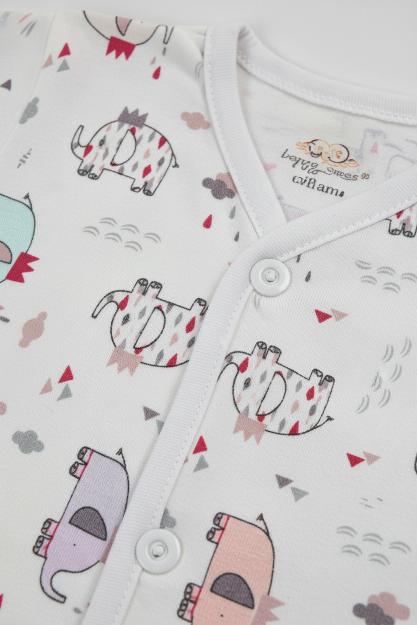 Close-up of cartoon animal print fabric texture and button detail on baby shirt