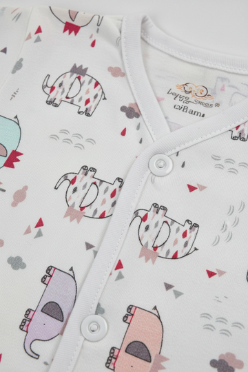 Close-up of cartoon animal print fabric texture and button detail on baby shirt