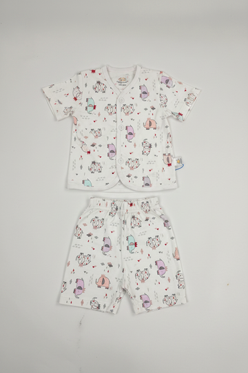 Baby shirt and shorts set with cartoon animal print laid flat on white background