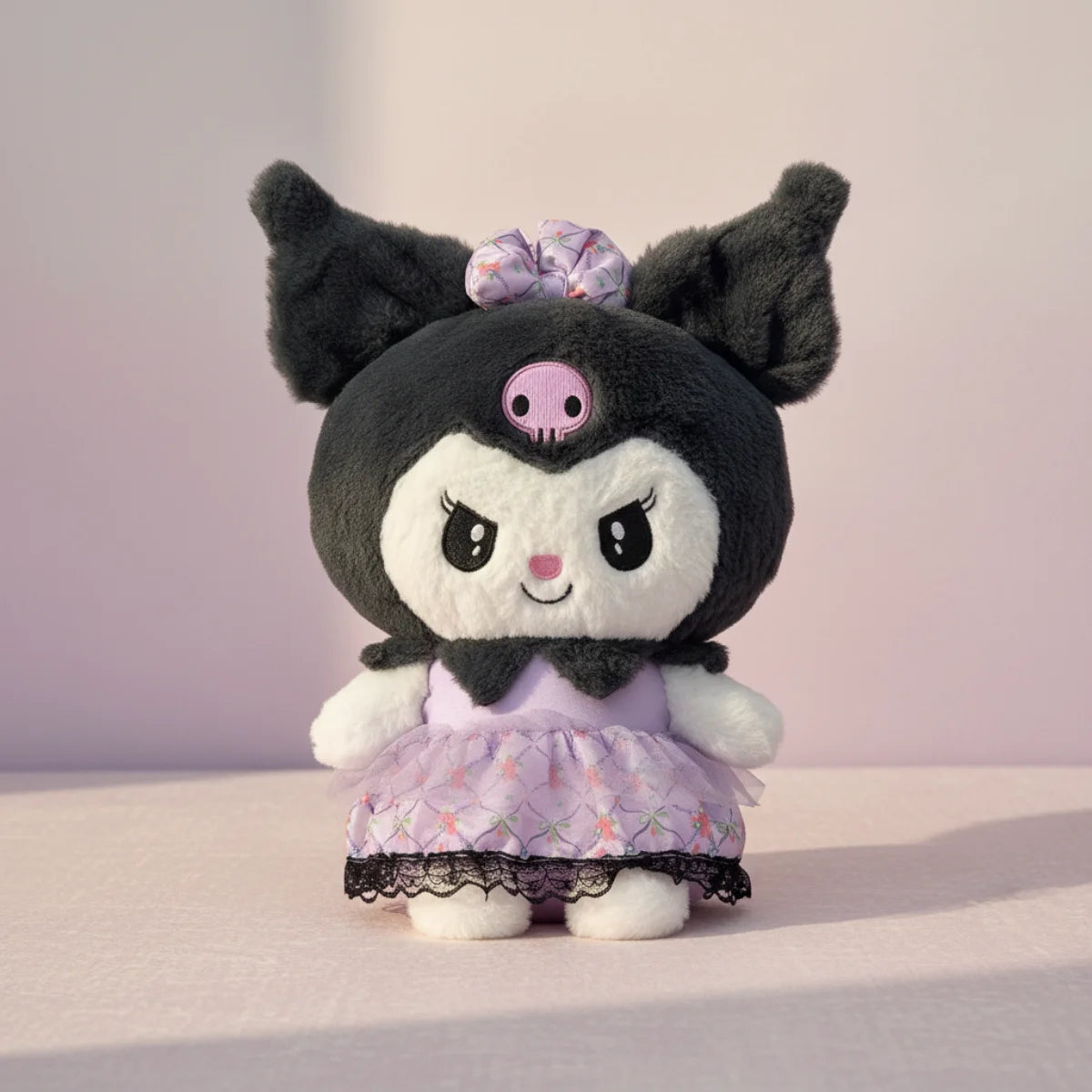 Kuromi plush toy with lavender lace dress standing pose on soft lavender background showing iconic black plush bat ears pink skull emblem expressive eyes lavender scrunchie bow and layered lavender lace trim dress with black hem