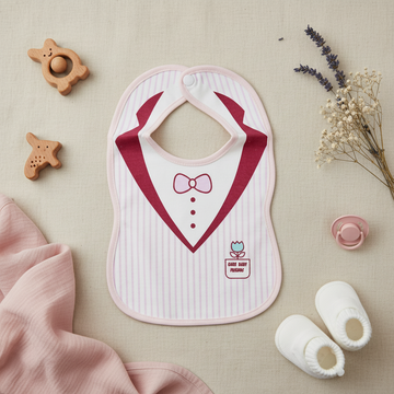 Care Baby Friends Tuxedo Baby Bib - lifestyle flat lay with baby shoes wooden teether pacifier and dried flowers on linen