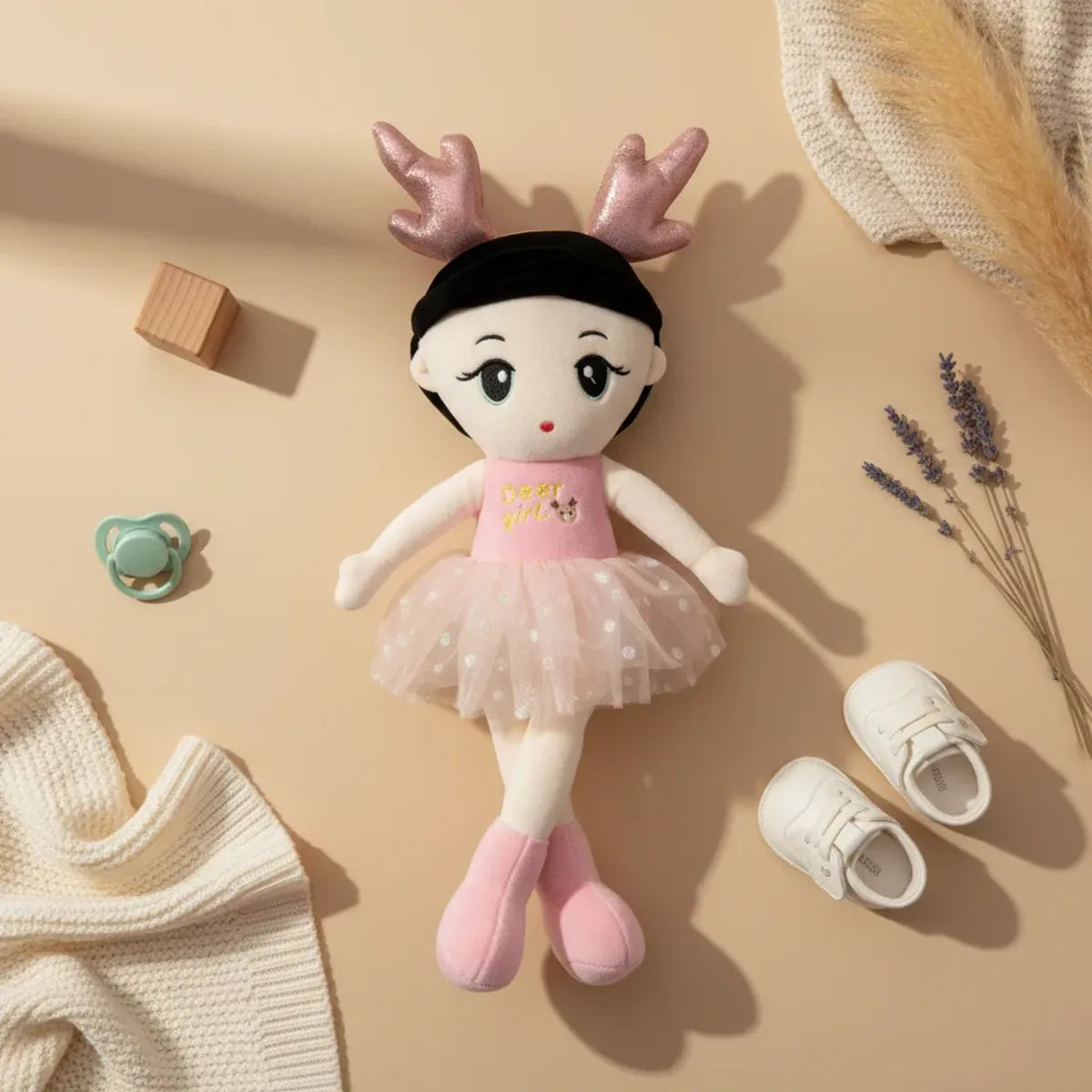 Fawn the Deer Ballerina doll flat lay with baby shoes pacifier and dried lavender