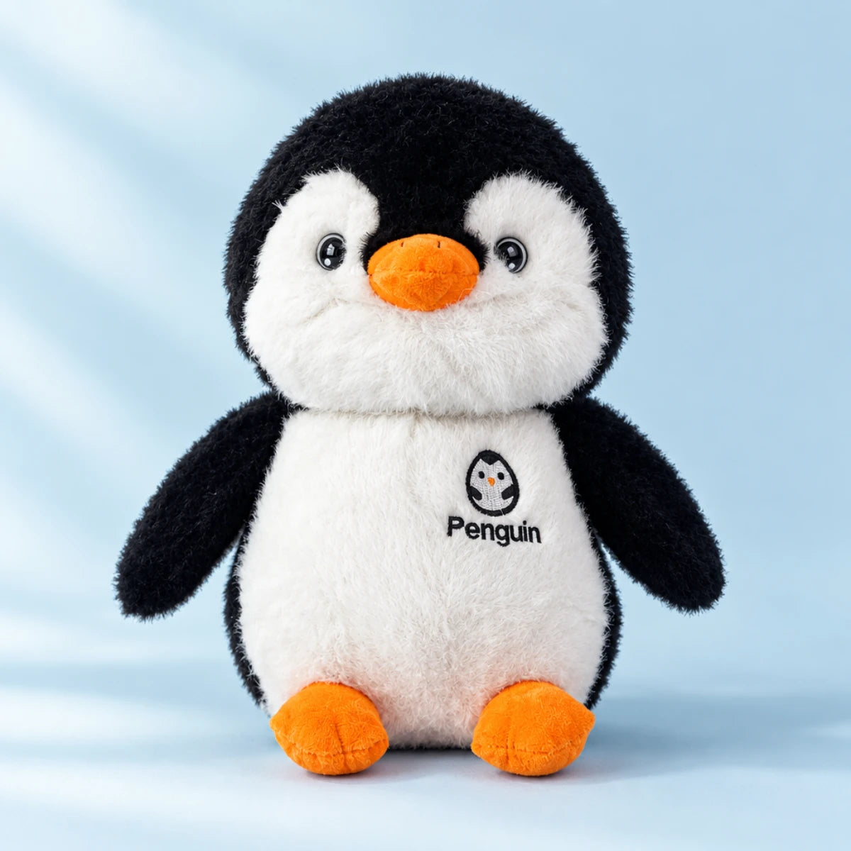 Penguin plush toy in a softly styled nursery setting