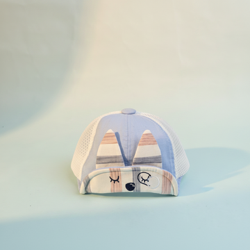 Baby Sleepy Bear Blue Plaid Mesh Cap - premium studio scene front view light blue background showing sleepy bear face and 3D ears