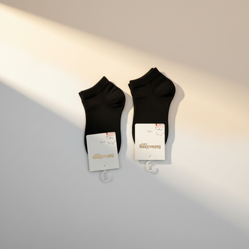 BeiHaoXiong Black Baby Ankle Socks - premium studio scene flat lay white background 2 pairs