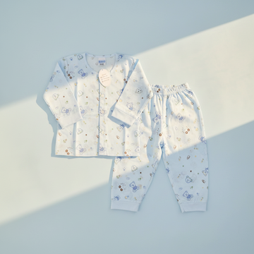 Mamo Blue Bear Bunny Print Baby Pyjama Set - premium studio scene flat lay on light blue background with natural window light and shadow showing full set with button front detail