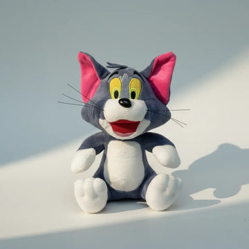 Whiskers grey cartoon cat plush toy studio shot on light blue background