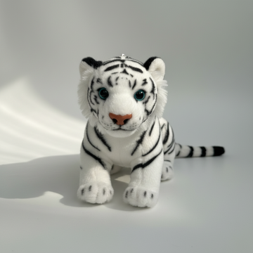 White tiger cub plush stuffed toy – premium studio scene on soft grey background showing full sitting pose with teal sparkling eyes