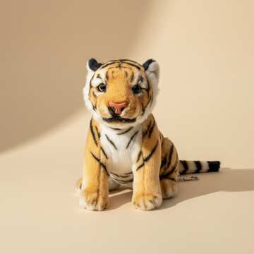 Bengal tiger cub plush stuffed toy – premium studio scene on warm beige background showing full sitting pose with realistic golden fur