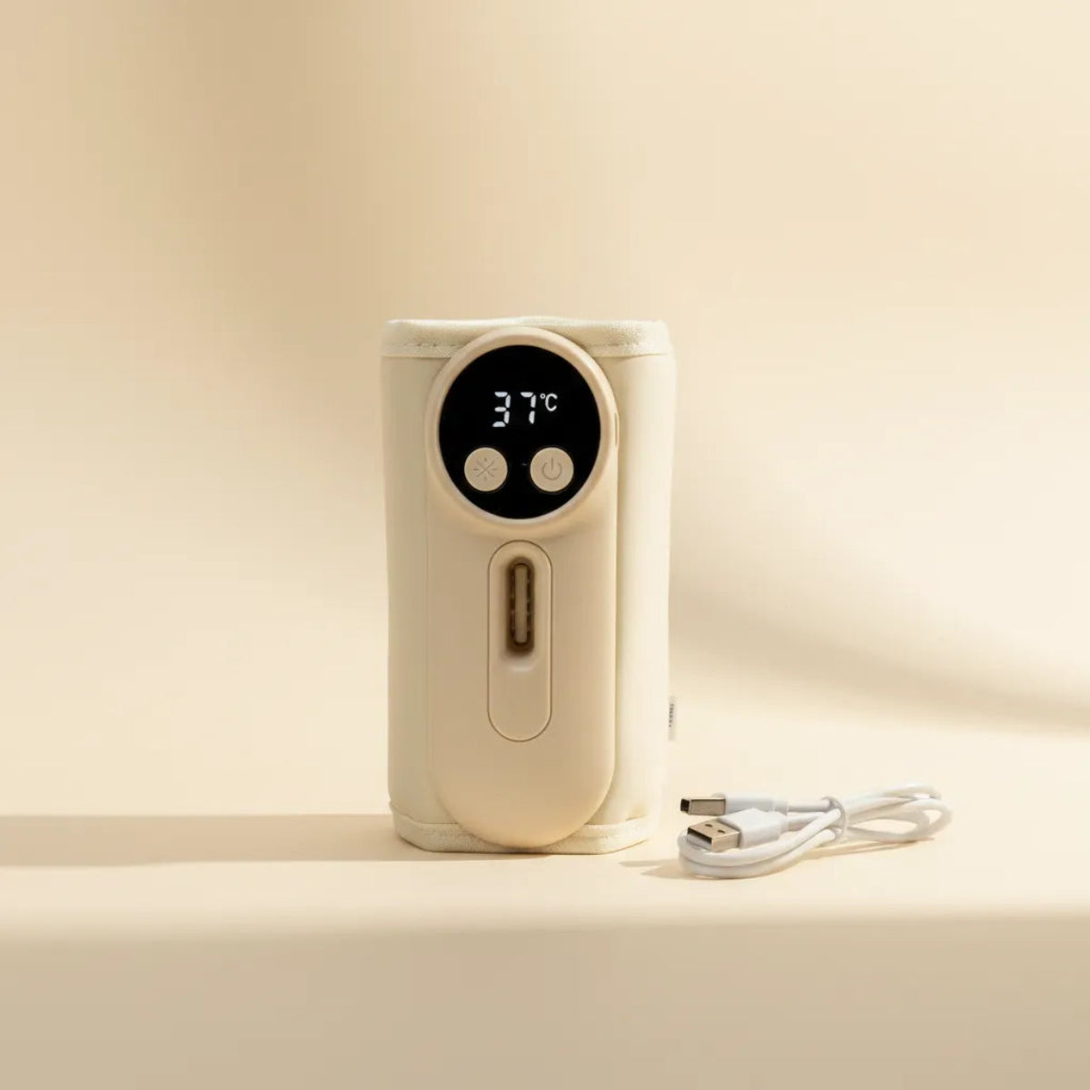 Smart Portable Baby Bottle Warmer in cream with LED display showing 37°C and USB-C charging cable on beige background
