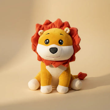 Roary the Cartoon Lion Cub plush toy studio shot on warm cream background showing golden body and rust-red mane